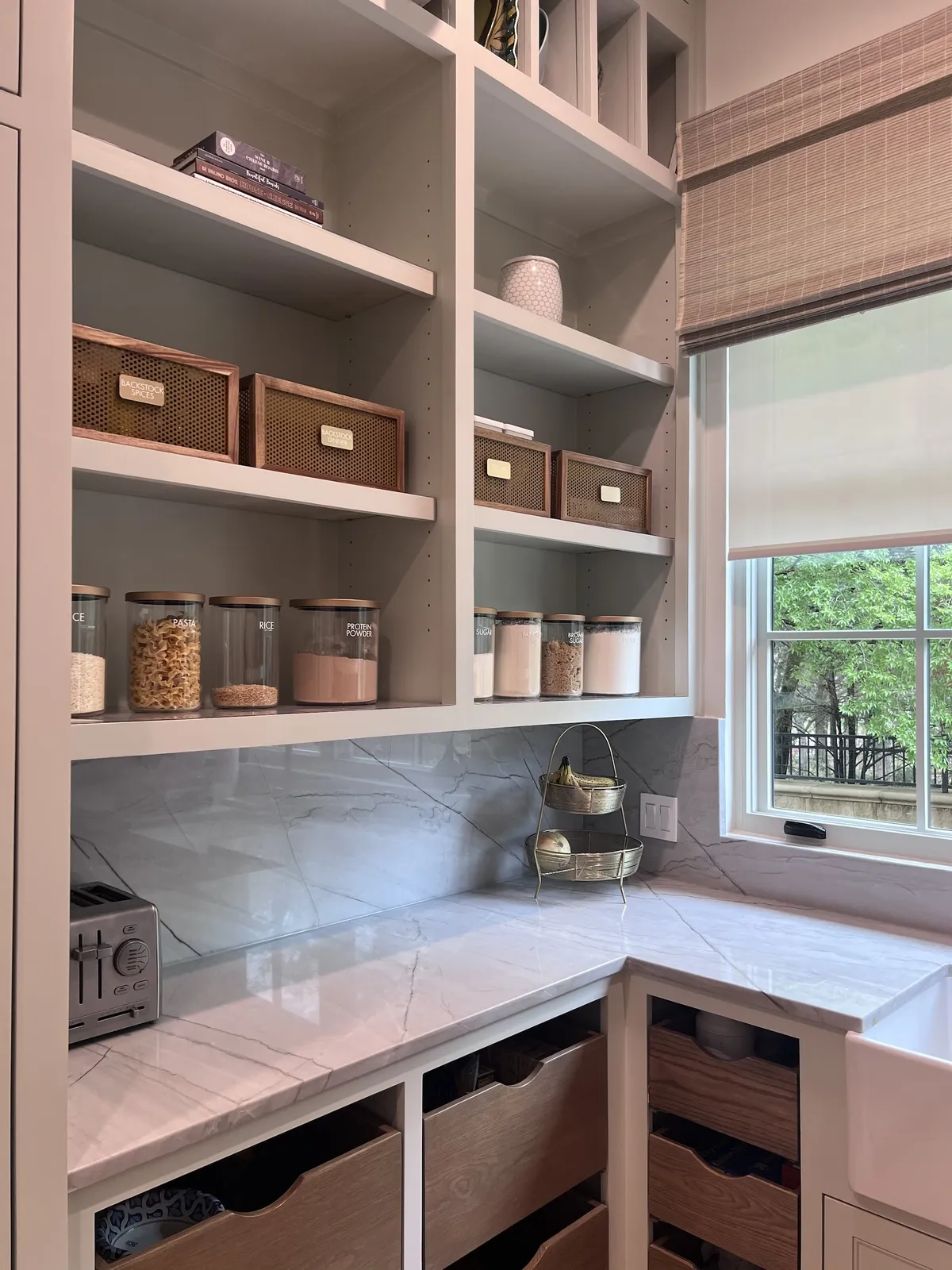 Pantry with lined open shelving and drawers