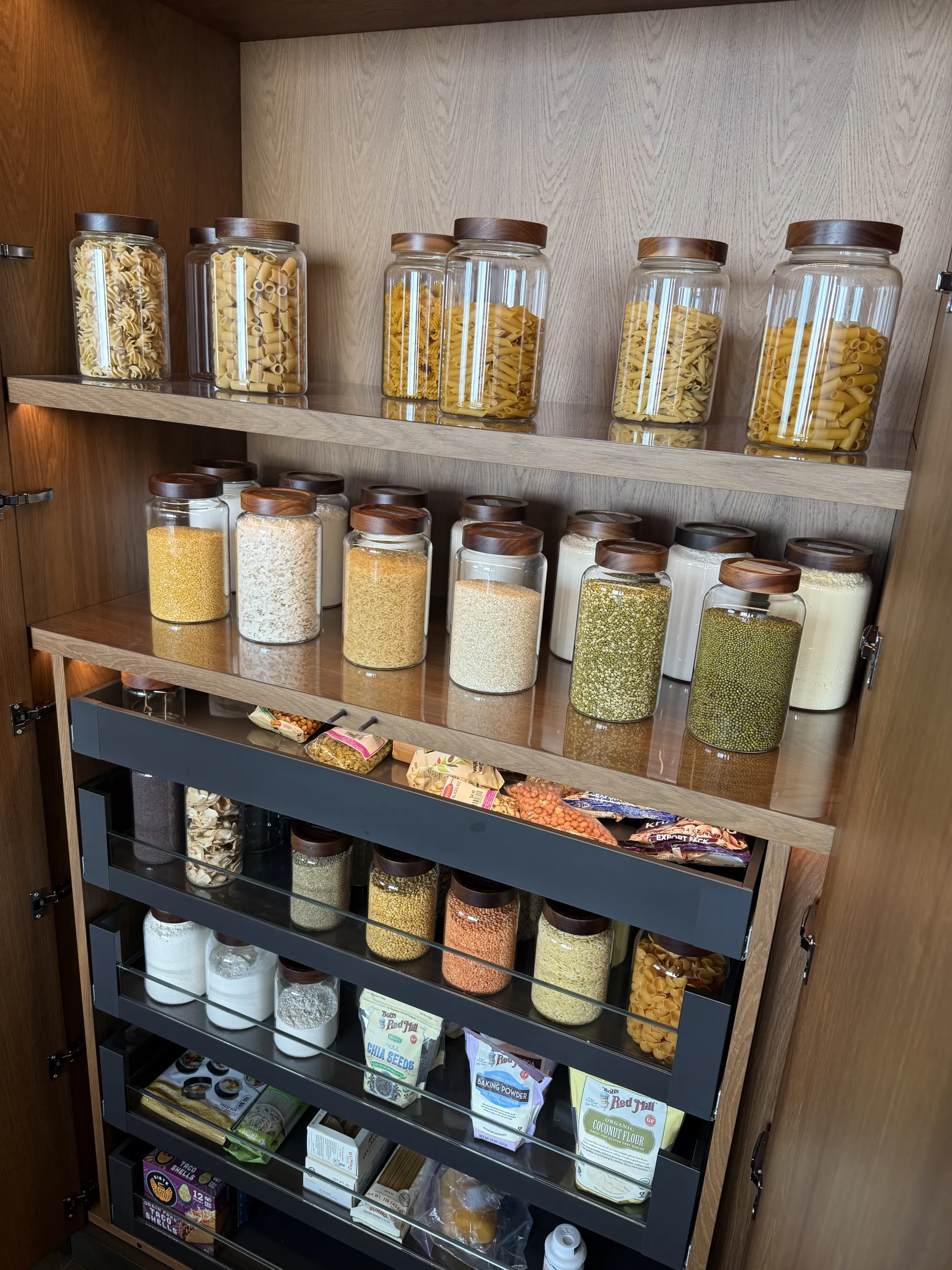 Pantry shelves and pull-out drawers lined with custom liners