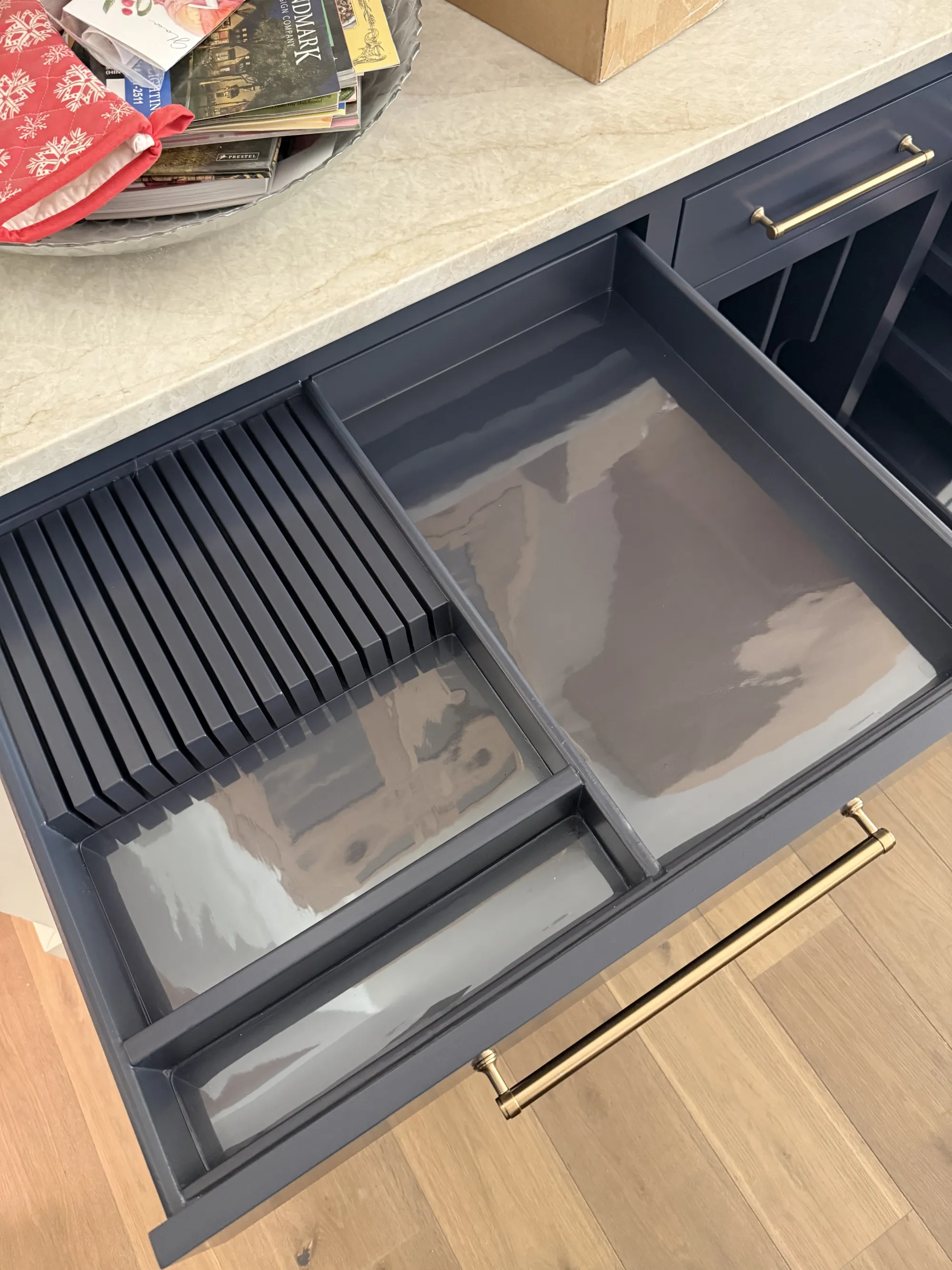 Clear liners cut to fit each compartment of a divided kitchen drawer